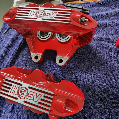 Freshly repainted Harrop calipers in Sting Red